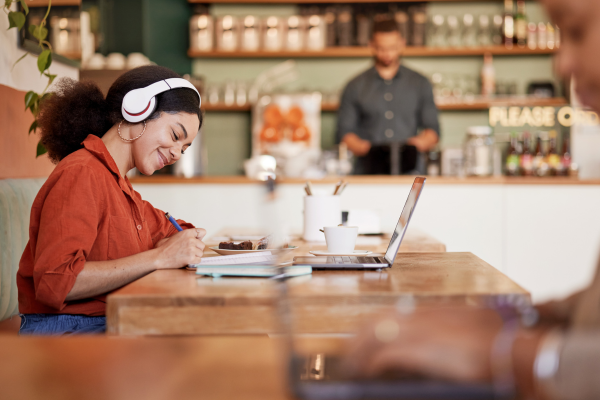 woman with headphones at coffeeshop