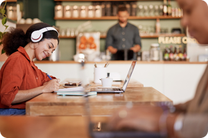 woman with headphones at coffeeshop