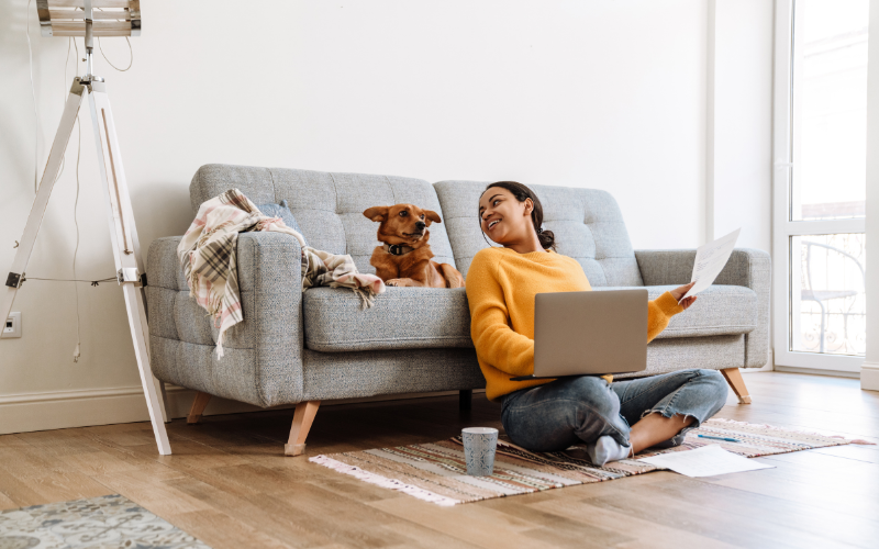 woman and dog on the computer